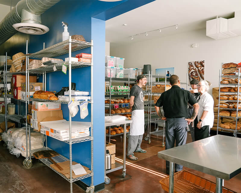 Don talks to a customer at the Barrio Break bakery in Tucson.