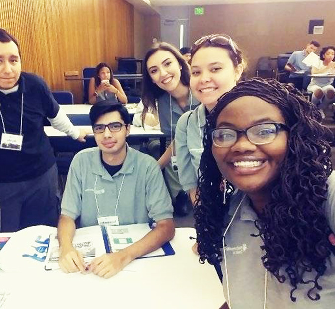 ConnectU Students working together on a project, pose for a selfie