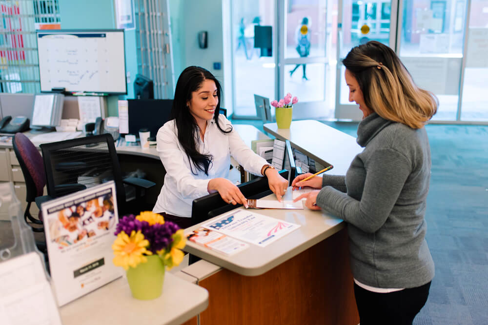 An advisor speaking with a student.