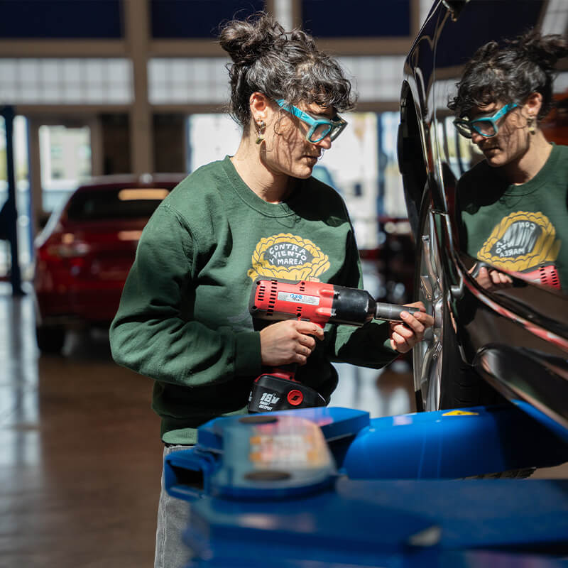 Alexa Works on a vehicles tires in the auto center