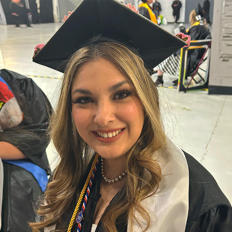 Gabriella smiles at Graduation