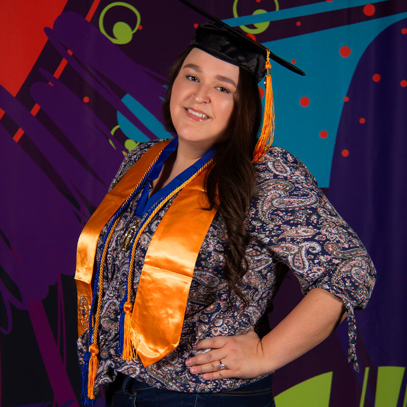 Molly posed for a photo at graduations