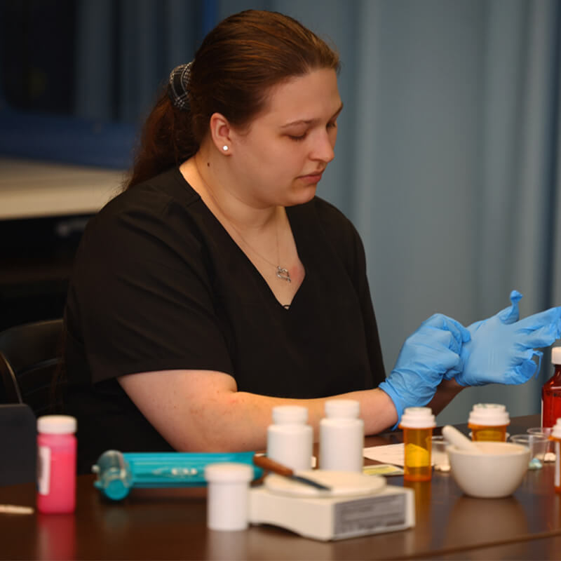 Sabrina working in a Pharmacy Lab